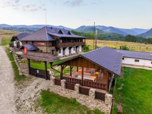 an overhead view of a large house with a roof at Casa de Oaspeti Caezu in Slatina
