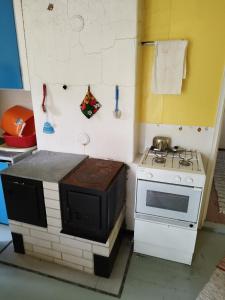 a toy kitchen with a stove and a microwave at Topsala MidIsland in Houtskari