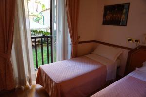 Postel nebo postele na pokoji v ubytování Green Hotel