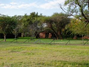 a park with a group of poles in the grass at Wild and Water Dinokeng in Dinokeng Game Reserve