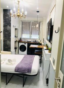 Ένα ή περισσότερα κρεβάτια σε δωμάτιο στο Po1-TPSA16-RDC- ROOM Paris 16 ème