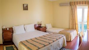 Cama ou camas em um quarto em Hotel Belsol