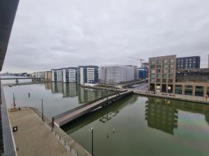 a view of a river in a city with buildings at ExCeL London-Exclusive 3 Bedroom in North Woolwich