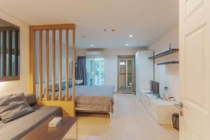 a living room with a bed and a couch at the view apartment 422 in Phuket Town