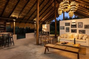 a living room with a couch and a table at Aranya Trails Wilpattu in Pahala Maragahawewa