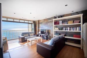 Et opholdsområde på Ático de Lujo en primera línea de mar