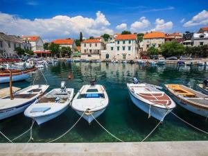 a group of boats are docked in a harbor at Apartment Tara in Sumartin