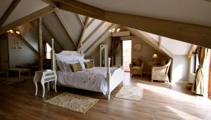 a bedroom with a bed in a attic at Driftwood Beach Villa in Gordonʼs Bay