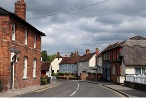 an empty street in a town with brick houses at Comfy Cottage Homestay Nr Chelmsford. Free Parking Great Views. 