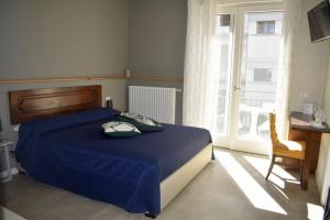 Postel nebo postele na pokoji v ubytování Il Trovatore Rooms