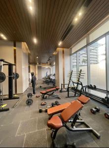 a gym with a bunch of exercise equipment in a room at Skystay in Greater Noida