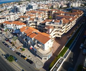 an aerial view of a city with buildings at Cyprus Paradise Island Queens Gardens Apartament in Paphos City +22 photos