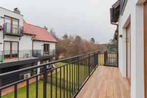 a view from the balcony of a house at Flatbook Apartamenty - Mikoszewo Baltic Cottage in Mikoszewo