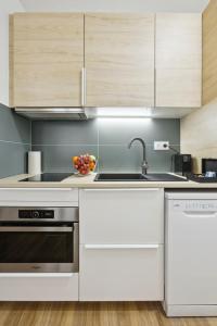 a kitchen with a sink and a bowl of fruit at 861 Suite Marguerite - Superb Apartment in Montreuil