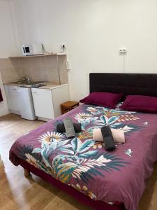 Postel nebo postele na pokoji v ubytování Hôtel Lyonnais