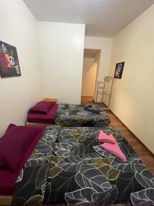 Postel nebo postele na pokoji v ubytování Hôtel Lyonnais