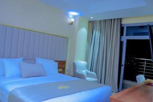 Postel nebo postele na pokoji v ubytování Jees Hotel