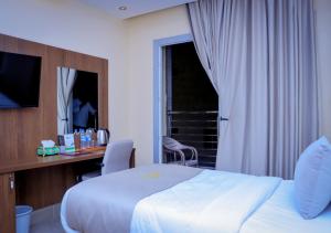 Postel nebo postele na pokoji v ubytování Jees Hotel