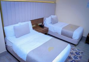 Postel nebo postele na pokoji v ubytování Jees Hotel