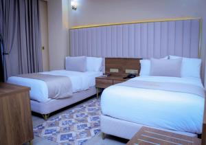 Postel nebo postele na pokoji v ubytování Jees Hotel
