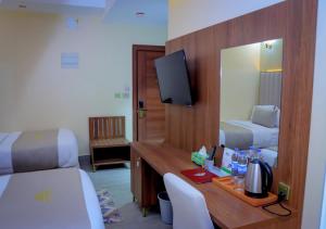 Postel nebo postele na pokoji v ubytování Jees Hotel