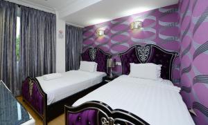 Postel nebo postele na pokoji v ubytování Seeds Hotel Shah Alam Seksyen 7 I-City