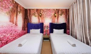 Postel nebo postele na pokoji v ubytování Seeds Hotel Shah Alam Seksyen 7 I-City