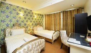 Postel nebo postele na pokoji v ubytování Seeds Hotel Shah Alam Seksyen 7 I-City