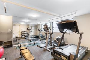 a gym with treadmills and elliptical machines at Seattle's Gem: Elegant 1BR in Belltown in Seattle