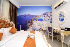 a bedroom with a view of the island of santorini at Seeds Hotel Shah Alam Section 19 in Shah Alam