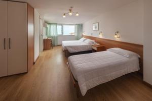 Posteľ alebo postele v izbe v ubytovaní Hotel Poseidon e Nettuno