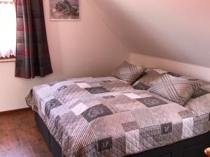 Postel nebo postele na pokoji v ubytování Ferienwohnung Dreimaster W2