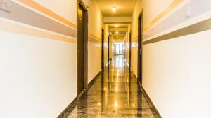 a corridor of an empty building with a long hallway at Local Colive Sarjapur in Bangalore