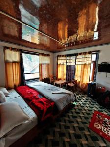 a bedroom with two beds in a train car at Forest inn pahalgam in Anantnāg