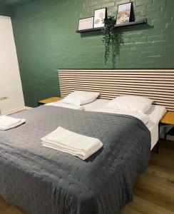 a bedroom with two beds with white towels on them at KonceptHotel in Oksbøl