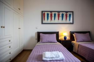 Postel nebo postele na pokoji v ubytování My Way Kavos Villa