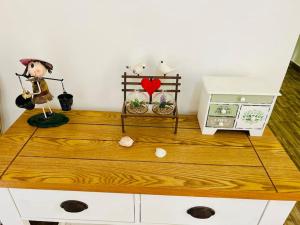 a table with two figurines on top of it at Seaside Duplex Home in St. Paul's Bay