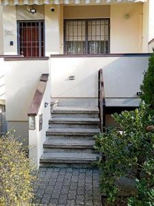 a set of stairs leading to a building at Elisa's House, Una coccola! in Castel San Pietro Terme