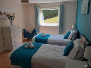 a bedroom with two beds and a window at Beach view in Spittal