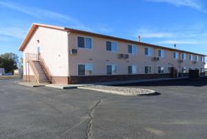 a large building with stairs in a parking lot at Days Inn by Wyndham Alamosa in Alamosa