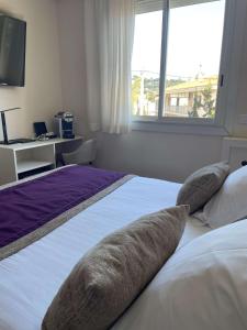 Postel nebo postele na pokoji v ubytování Best Western Plus Hôtel la Rade