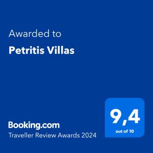 a blue text box with the words awarded to petits villas at Petritis Villas in Iraklitsa