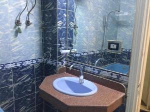a bathroom with a sink with a shower and a tub at Babylon guesthouse in Aswan +47 photos