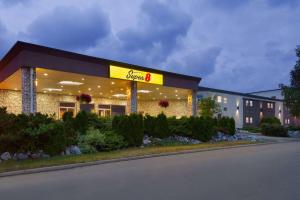 a store with a sign on the front of it at Super 8 by Wyndham Prince George in Prince George