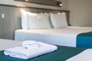 Postel nebo postele na pokoji v ubytování Comfort Inn Glenelg