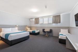 Postel nebo postele na pokoji v ubytování Comfort Inn Glenelg