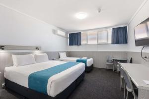 Postel nebo postele na pokoji v ubytování Comfort Inn Glenelg