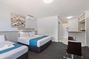 Postel nebo postele na pokoji v ubytování Comfort Inn Glenelg + 29 fotografií