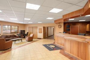 a large lobby with a waiting room with couches at Days Inn by Wyndham Swift Current in Swift Current