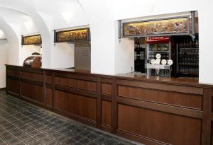 a bar in a restaurant with a counter at Pivovar a restaurace Faltus in Česká Třebová